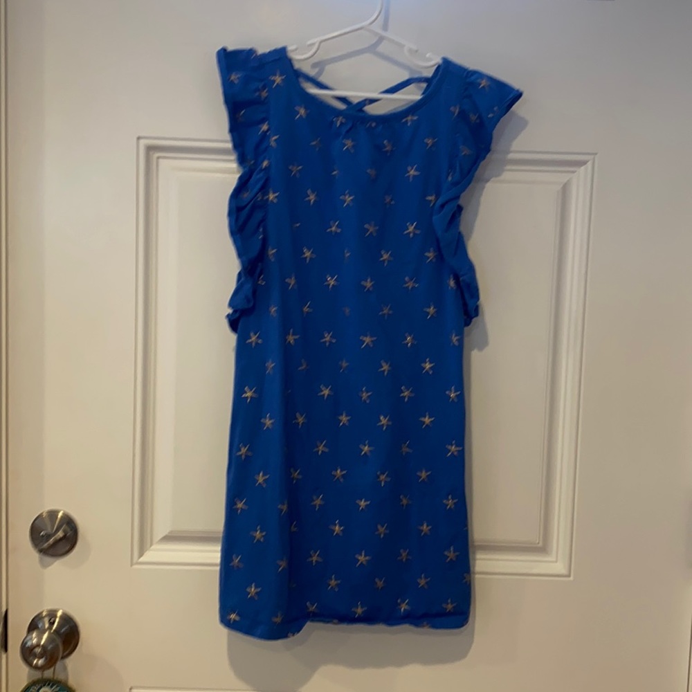 Tea dress size 8. Blue with gold star detail and criss cross back. Worn once.